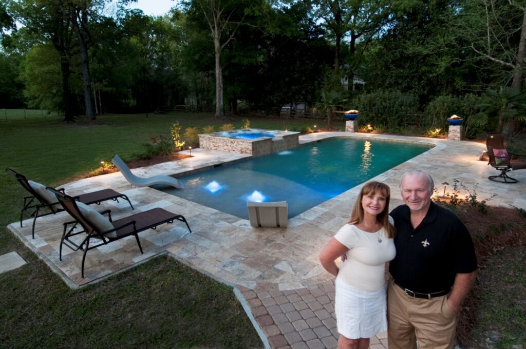 Picture of Charles and Cindy in front of a pool.