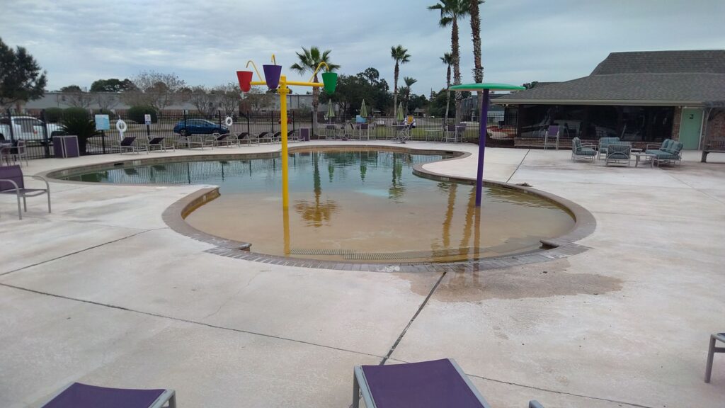 Before renovation picture of a pool in Harvey.