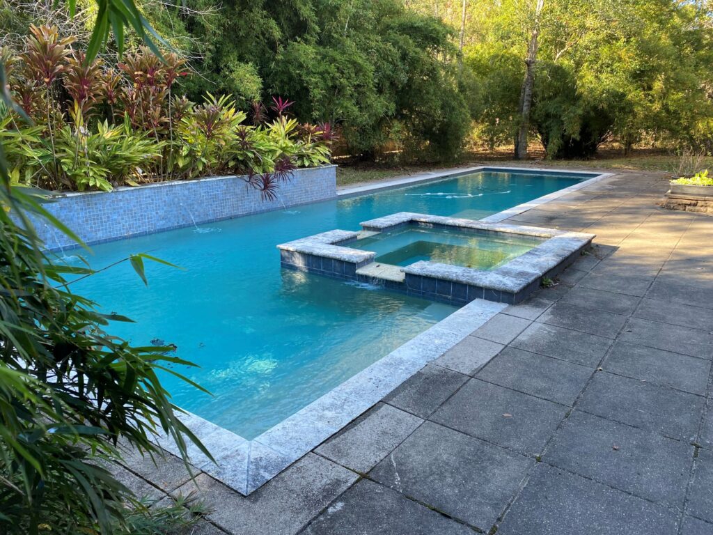 Before renovation picture of a pool in Lacombe.